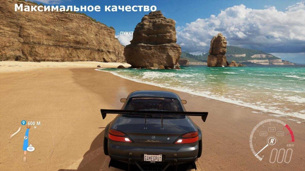 Автомобиль Nissan Silvia с спойлером на песчаном пляже