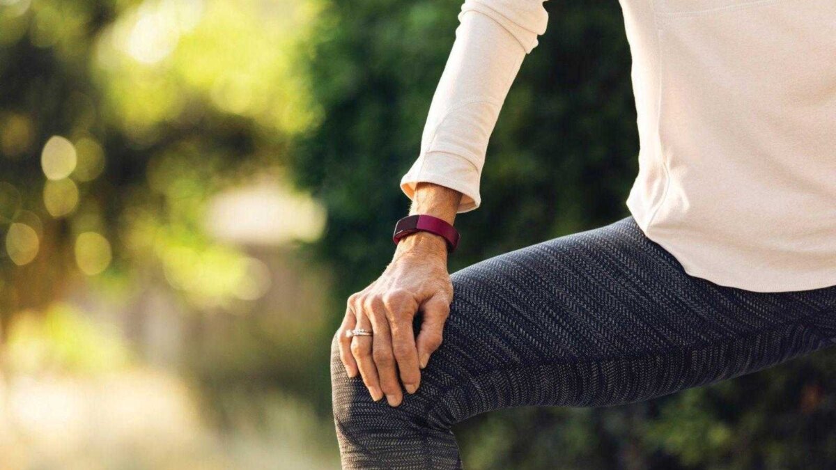 fitbit inspire lifestyle grandparents sidewalk girl stretching 075