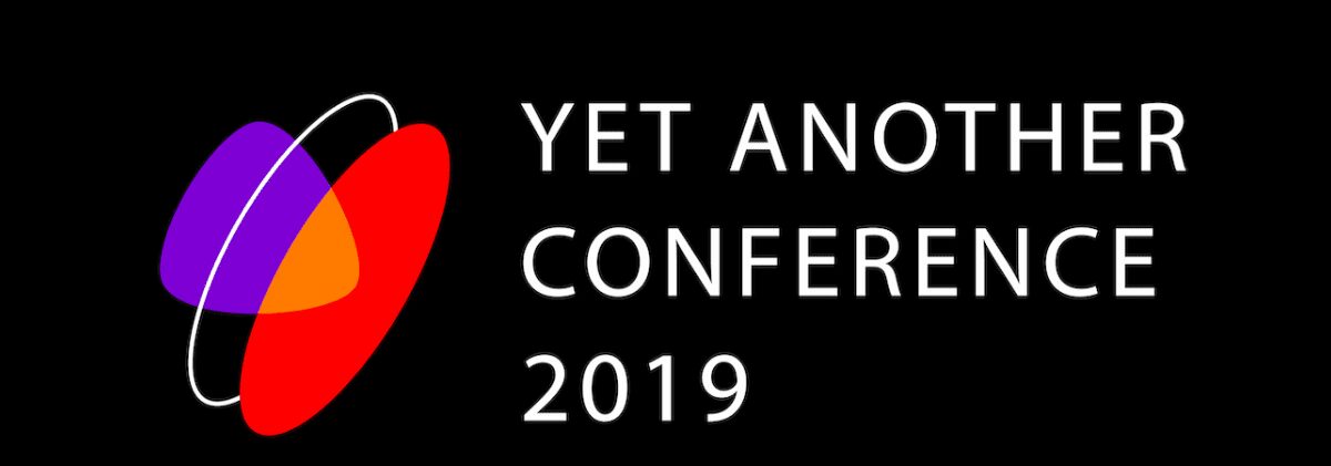 Логотип конференции Яндекс 2019 с цветными овалами и текстом