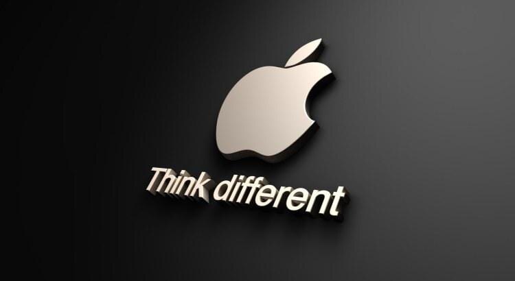 Логотип Apple с надписью Think different на темном фоне