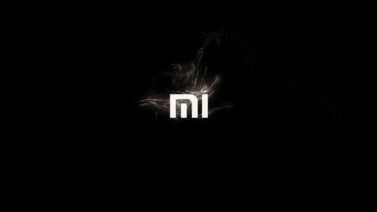 Цветной логотип Xiaomi на черном фоне с динамическими линиями