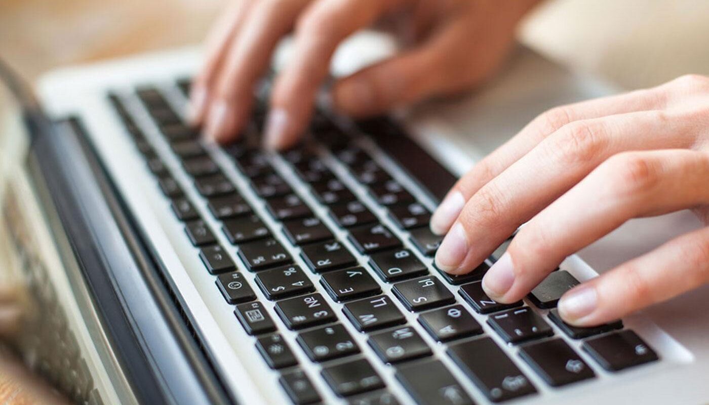 hands-keyboard-laptop-computer