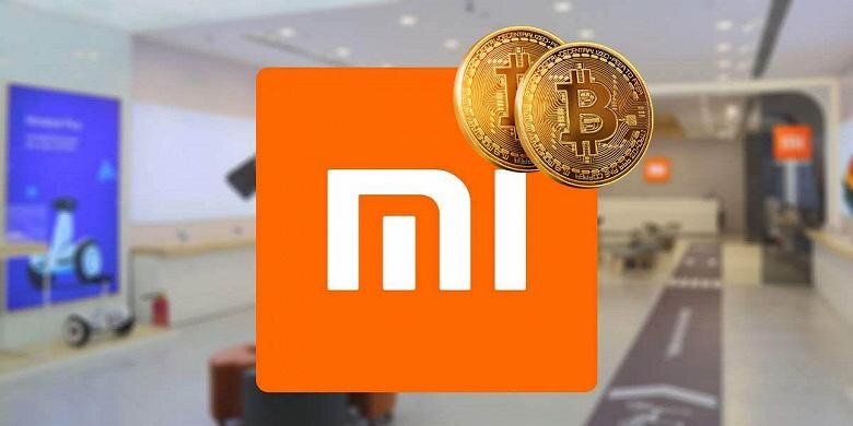 Логотип Xiaomi с изображением двух биткойнов в верхней части