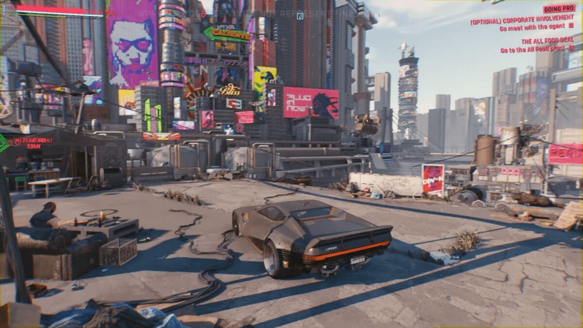 Автомобиль из игры Cyberpunk 2077 на разрушенной улице с рекламными плакатами