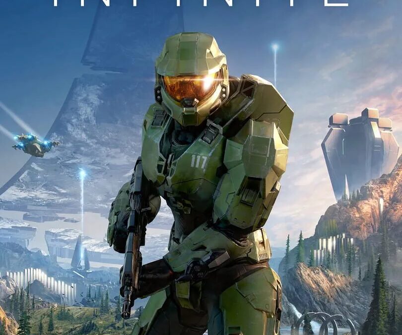 Обложка игры Halo Infinite с героем в бронированной броне на фоне пейзажа