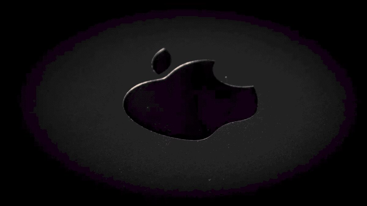 Логотип Apple Vision Pro на черной поверхности с жидкостью