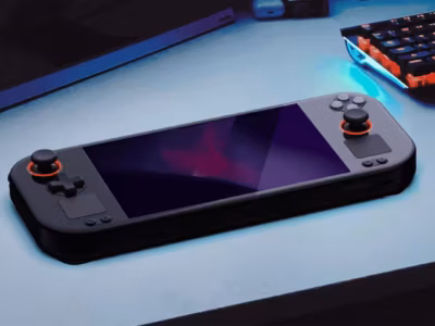 Портативная игровая консоль Orange Pi Neo с экраном на столе и процессором AMD Ryzen 7