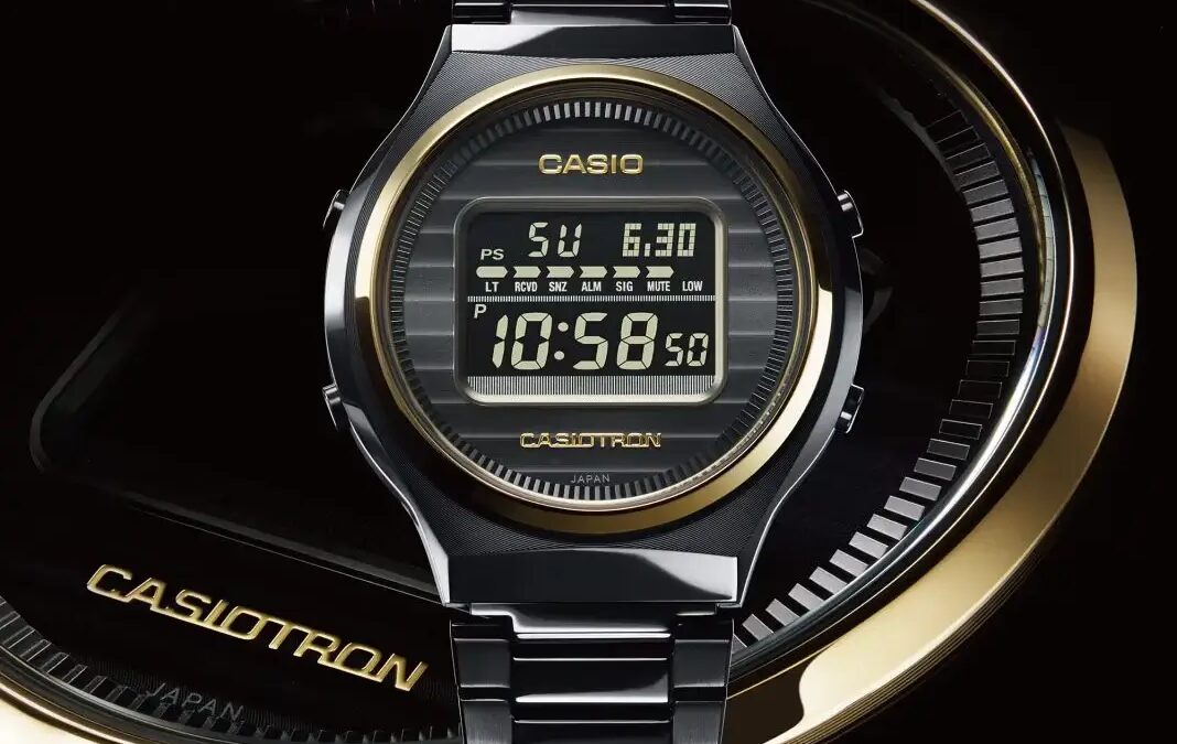 Цифровые часы Casio Casiotron TRN-50ZE-1A на темном фоне с золотым ободом и ремешком