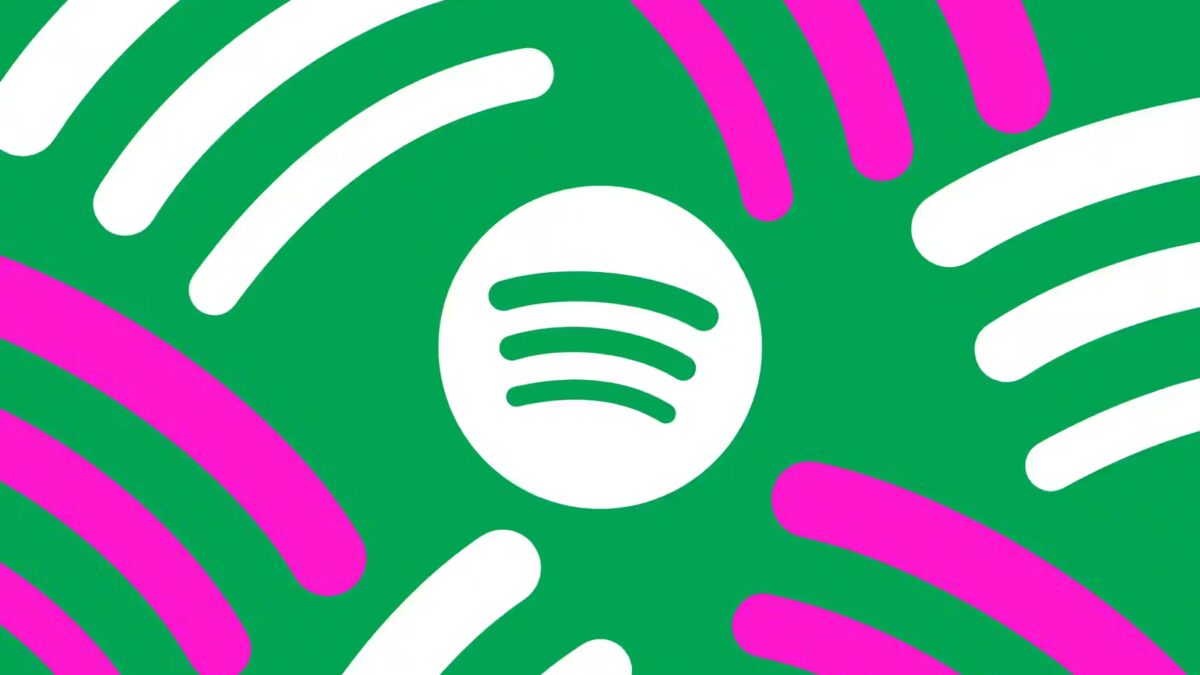 Иконка Spotify на ярком зеленом фоне с цветными полосами