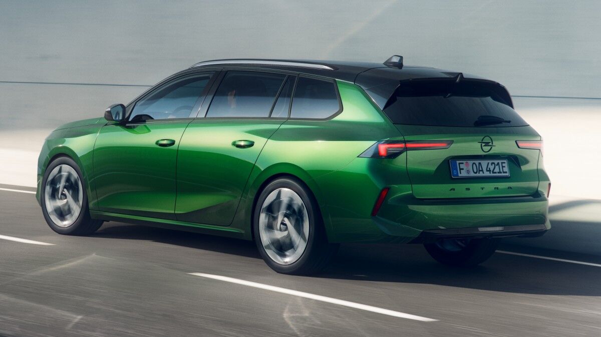 Черный и желтый электромобиль Honda в профиль