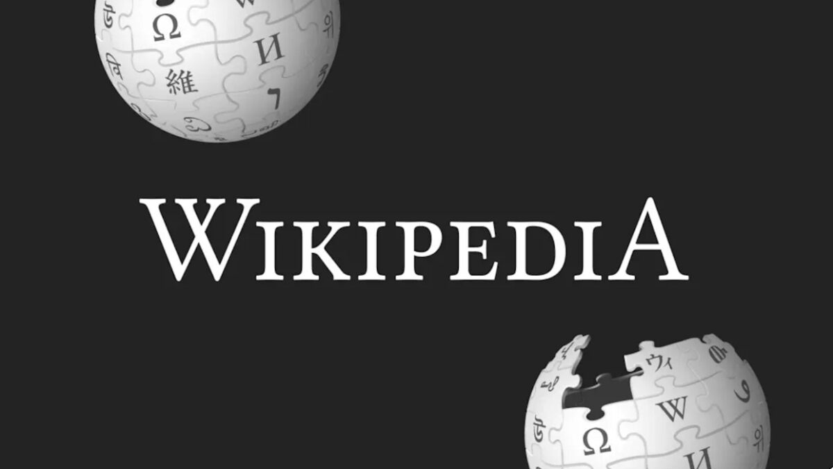 Чёрная обложка Википедии с изображениями земных шаров