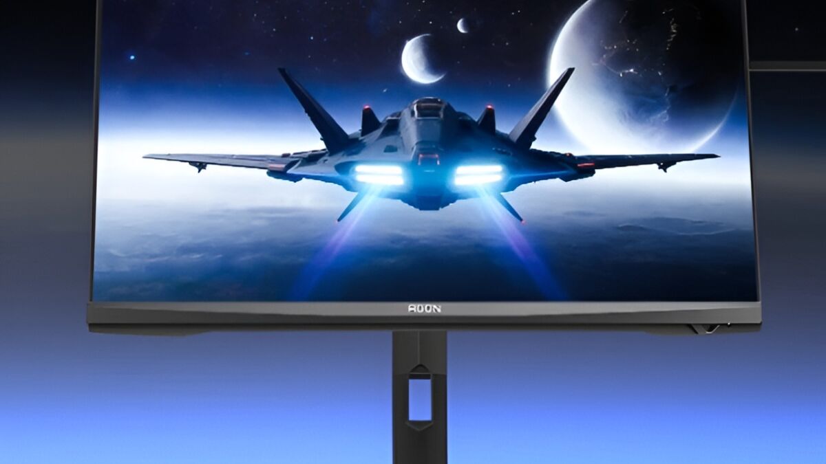 Компьютерный монитор AOC Agon Pro AGP277KX с изображением космического корабля и планет
