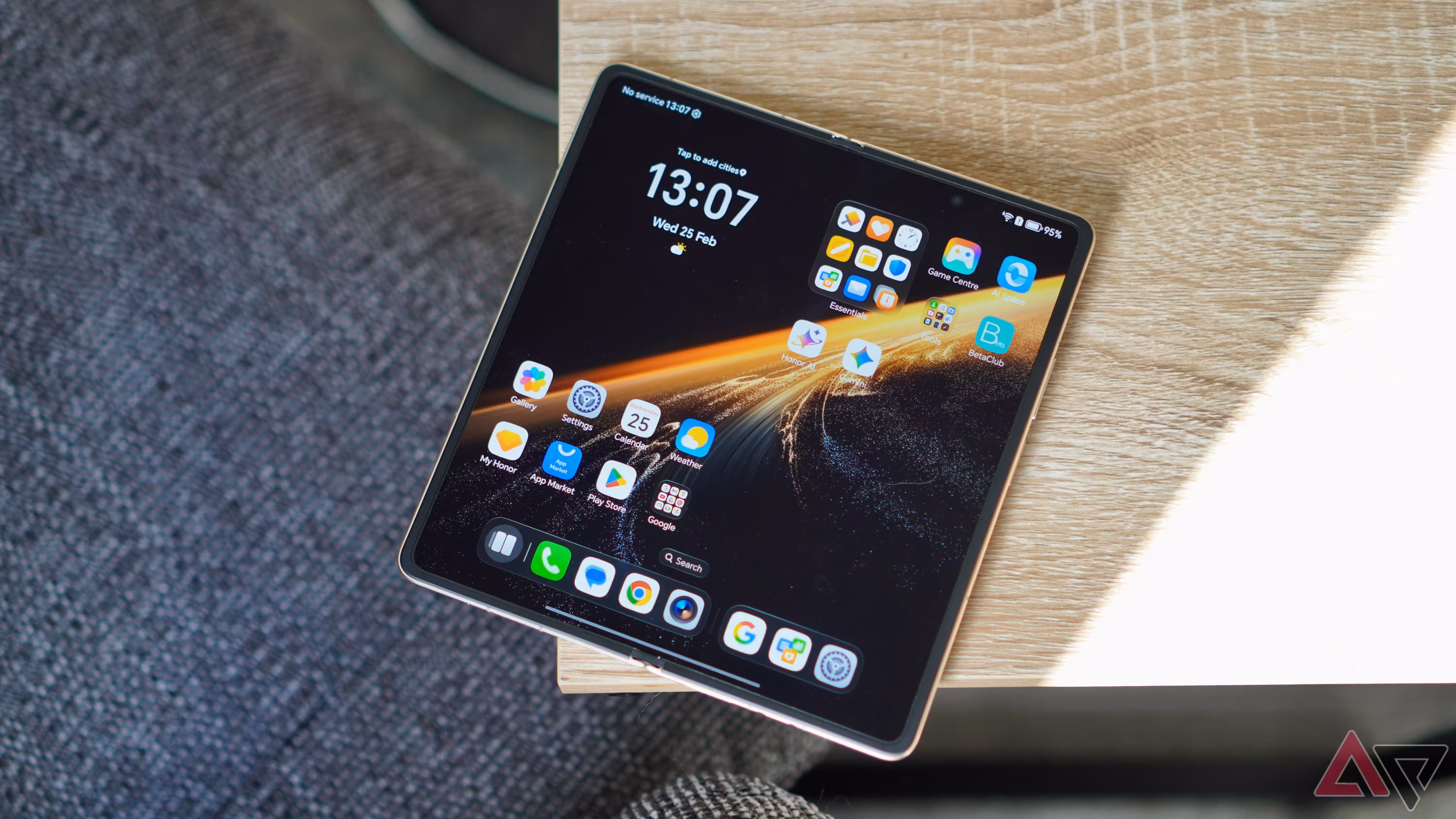 The open Honor Magic V6 on a table