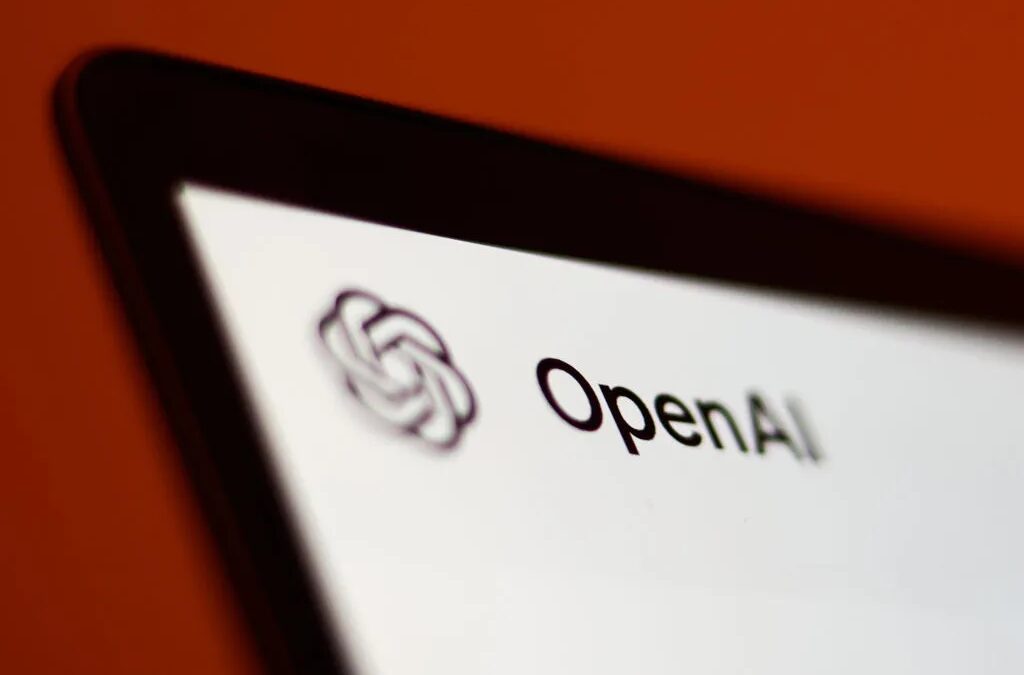 Логотип OpenAI на смартфоне около красной поверхности