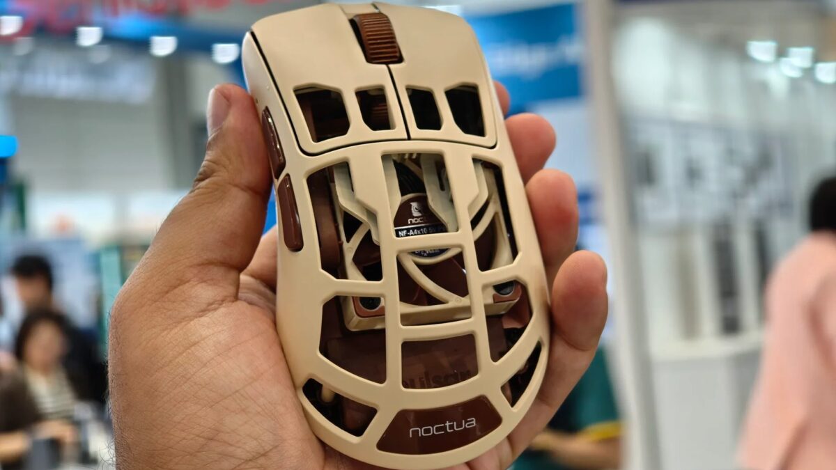 рукой держится компьютерная мышь Noctua с конструкцией из пластика